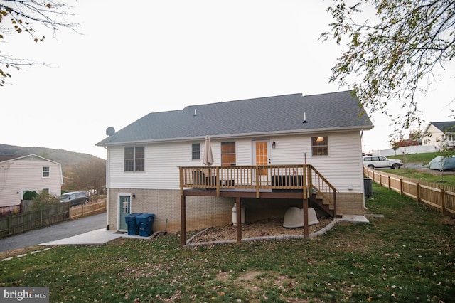 110 Jamestown Rd, Front Royal, VA 22630 - rear view of house with a wooden deck and brick siding
