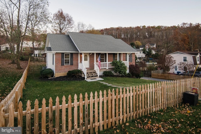 110 Jamestown Rd, Front Royal, VA 22630 - view of front of house with a porch, brick siding, and roof with shingles