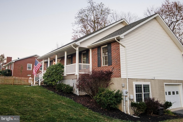 110 Jamestown Rd, Front Royal, VA 22630 - view of property exterior with brick siding, a porch, and a garage