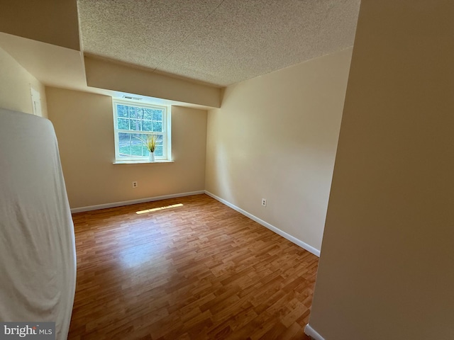 3011 Valley Dr Unit 3011, West Chester, PA 19382 - unfurnished room featuring wood finished floors and a textured ceiling
