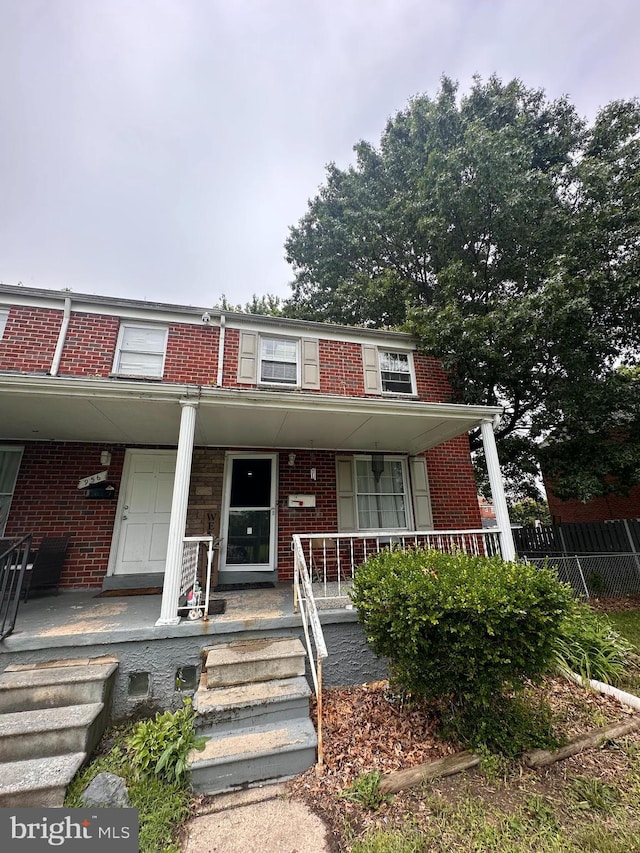 958 Middleborough, Baltimore, MD 21221 - view of property featuring brick siding and covered porch