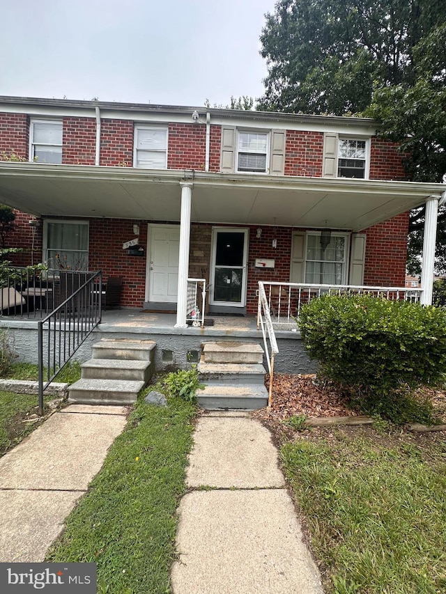 958 Middleborough, Baltimore, MD 21221 - view of property featuring brick siding and a porch
