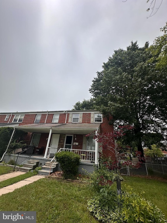958 Middleborough, Baltimore, MD 21221 - view of front facade with brick siding and covered porch