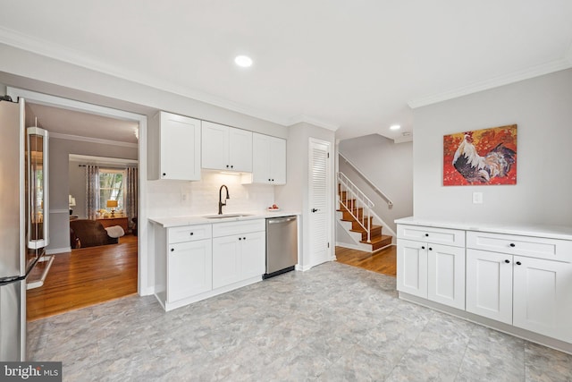 121 Harrison St NE, Leesburg, VA 20176 - kitchen featuring stainless steel appliances, crown molding, light countertops, white cabinets, and recessed lighting