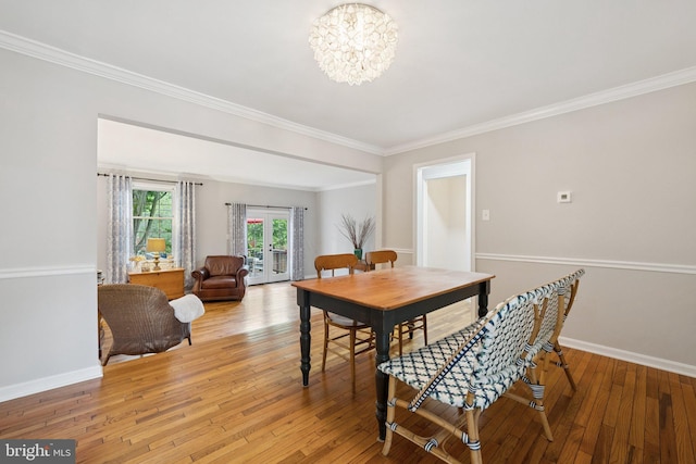 121 Harrison St NE, Leesburg, VA 20176 - dining area featuring a chandelier, ornamental molding, and light wood finished floors