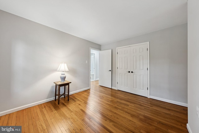 121 Harrison St NE, Leesburg, VA 20176 - unfurnished bedroom with hardwood / wood-style flooring and a closet