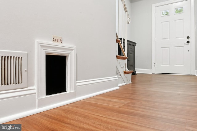 121 Harrison St NE, Leesburg, VA 20176 - foyer entrance featuring wood finished floors and stairs