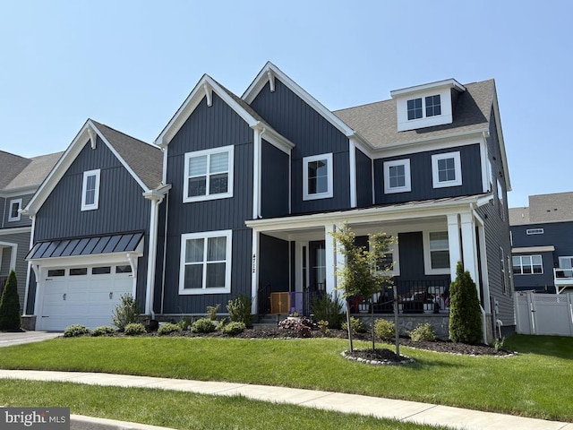4712 Hazelnut Ct, Monrovia, MD 21770 - modern farmhouse featuring a porch, a standing seam roof, a garage, and board and batten siding
