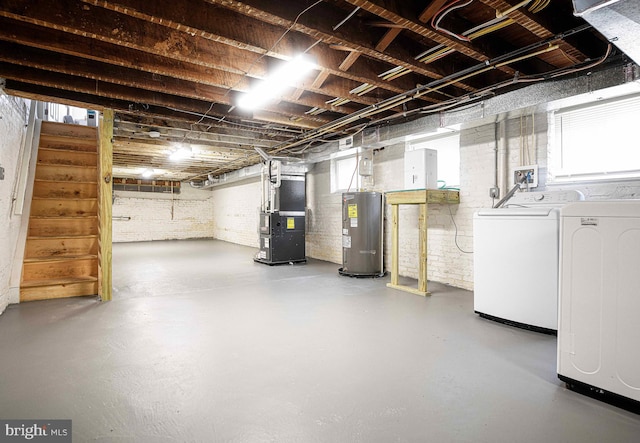 535 N Decker Ave, Baltimore, MD 21205 - basement featuring washing machine and clothes dryer, heating unit, water heater, stairway, and healthy amount of natural light