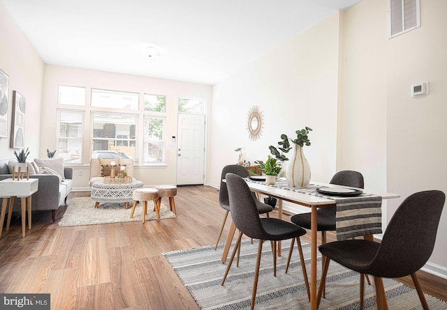 535 N Decker Ave, Baltimore, MD 21205 - dining room featuring light wood-type flooring and baseboards