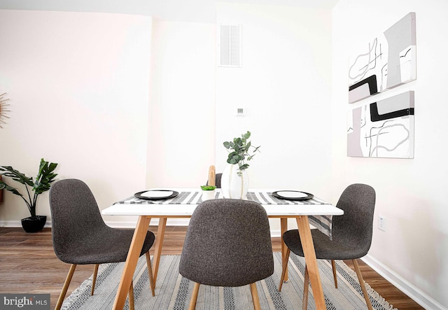 535 N Decker Ave, Baltimore, MD 21205 - dining room featuring wood finished floors and baseboards