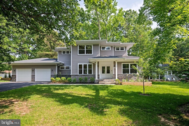 1227 Cross Rd, Annapolis, MD 21403 - view of front of home with stone siding, asphalt driveway, an attached garage, and a front lawn