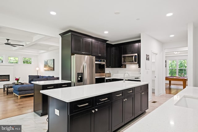 1227 Cross Rd, Annapolis, MD 21403 - kitchen with appliances with stainless steel finishes, an island with sink, ceiling fan, recessed lighting, and open floor plan
