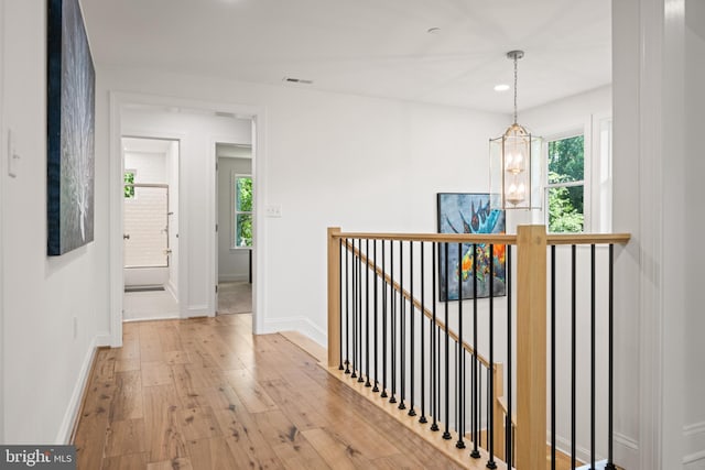 1227 Cross Rd, Annapolis, MD 21403 - hallway with an upstairs landing, a chandelier, hardwood / wood-style flooring, and recessed lighting