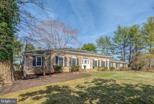 10828 Moore Dr, Manassas, VA 20111 - view of front of home featuring a front lawn and brick siding