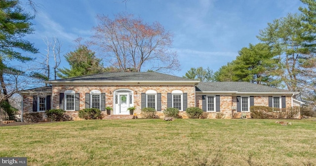 10828 Moore Dr, Manassas, VA 20111 - view of front of property with a front lawn, brick siding, and a shingled roof