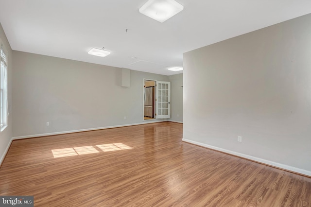 10828 Moore Dr, Manassas, VA 20111 - empty room with light wood finished floors and baseboards