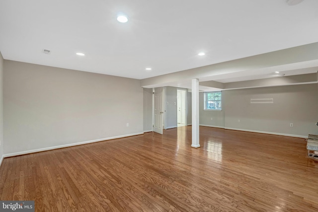 10828 Moore Dr, Manassas, VA 20111 - below grade area featuring wood finished floors and recessed lighting