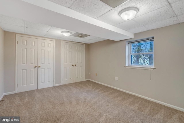 10828 Moore Dr, Manassas, VA 20111 - unfurnished bedroom featuring a paneled ceiling, carpet floors, and two closets