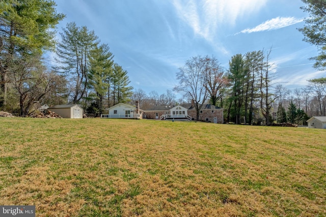 10828 Moore Dr, Manassas, VA 20111 - view of grassy yard featuring a shed