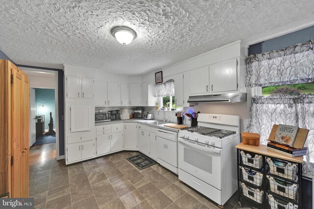 755 W Market St, Orwigsburg, PA 17961 - kitchen featuring white appliances, under cabinet range hood, white cabinets, light countertops, and a textured ceiling