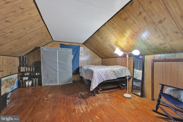 755 W Market St, Orwigsburg, PA 17961 - bedroom featuring hardwood / wood-style floors, wood walls, and vaulted ceiling