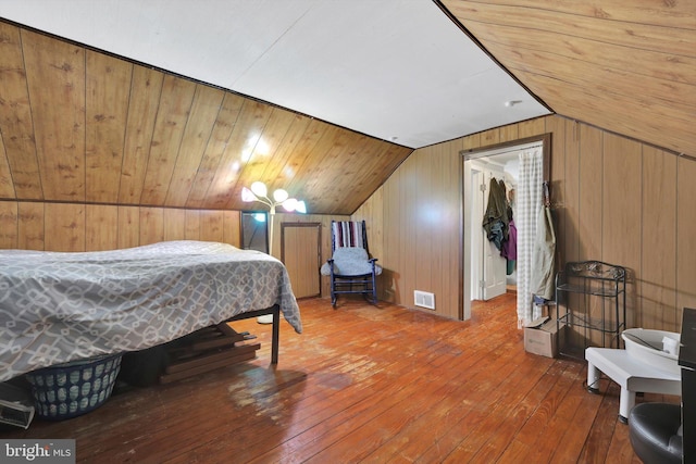 755 W Market St, Orwigsburg, PA 17961 - bedroom featuring lofted ceiling, hardwood / wood-style floors, wooden walls, a spacious closet, and a closet