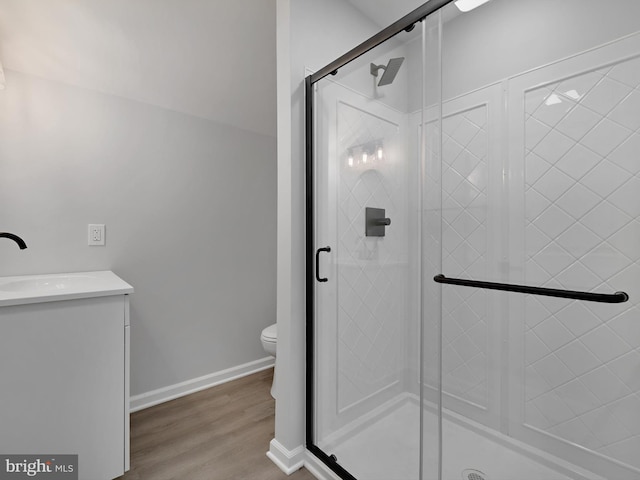 7811 Harbor Rd, Pasadena, MD 21122 - bathroom with a shower stall, vanity, and wood finished floors