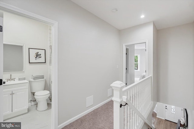 3209 Grayson St, Baltimore, MD 21216 - hallway featuring an upstairs landing and a sink