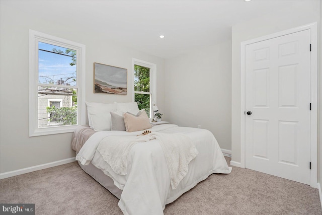 3209 Grayson St, Baltimore, MD 21216 - bedroom with multiple windows, light carpet, and recessed lighting