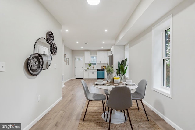 3209 Grayson St, Baltimore, MD 21216 - dining space featuring light wood-style floors and recessed lighting