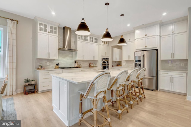 40928 Arcadian Pond Ct, Aldie, VA 20105 - kitchen featuring high quality fridge, wall chimney exhaust hood, decorative backsplash, light wood finished floors, and white cabinets