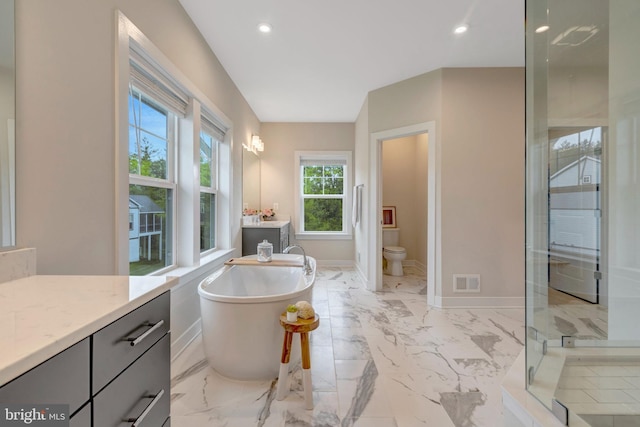 40928 Arcadian Pond Ct, Aldie, VA 20105 - bathroom with a soaking tub, vanity, a stall shower, marble finish floors, and recessed lighting
