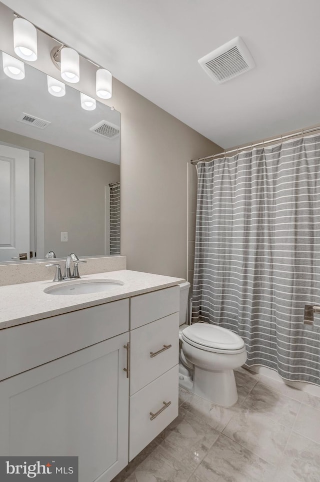 40928 Arcadian Pond Ct, Aldie, VA 20105 - bathroom featuring vanity, marble finish floors, and a shower with curtain