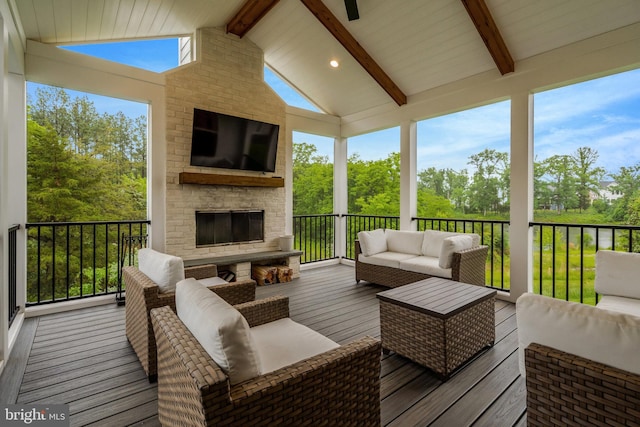 40928 Arcadian Pond Ct, Aldie, VA 20105 - wooden terrace with an outdoor living space with a fireplace and view of scattered trees