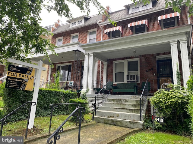 4419 New Hampshire Ave NW, Washington, DC 20011 - american foursquare style home featuring brick siding, a porch, and mansard roof