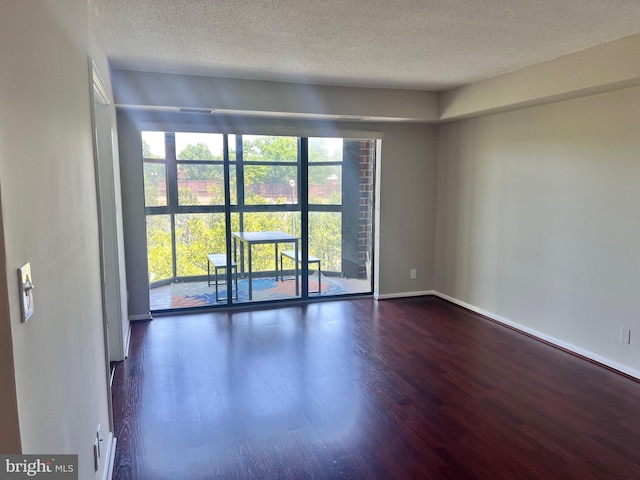 2100 Langston Blvd Unit 406, Arlington, VA 22201 - spare room with wood finished floors and a textured ceiling