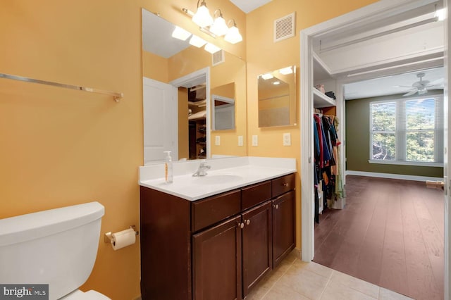 1391 Pennsylvania Ave SE Unit 247, Washington, DC 20003 - bathroom with vanity, a ceiling fan, tile patterned floors, and a walk in closet