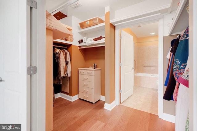 1391 Pennsylvania Ave SE Unit 247, Washington, DC 20003 - walk in closet featuring light wood-style floors