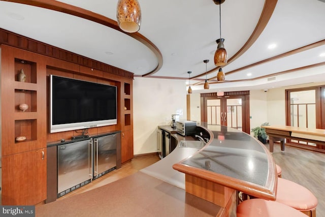 1391 Pennsylvania Ave SE Unit 247, Washington, DC 20003 - bar area featuring refrigerator, recessed lighting, and hanging light fixtures