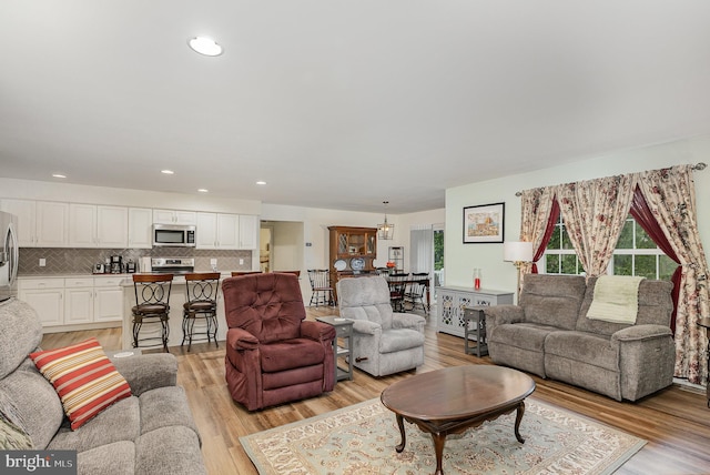 2069 Spring Wood Ln, Mechanicsburg, PA 17055 - living room featuring light wood-style flooring and recessed lighting