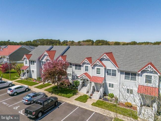 9707 Village Ln Unit 9704-4, Ocean City, MD 21842 - view of building exterior featuring uncovered parking and a residential view