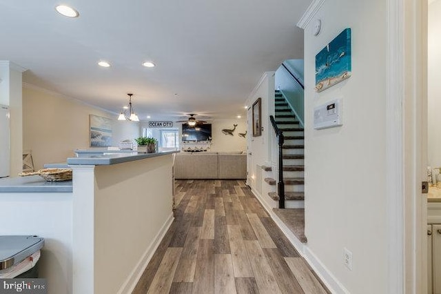 9707 Village Ln Unit 9704-4, Ocean City, MD 21842 - hall with stairway, wood finished floors, ornamental molding, and recessed lighting