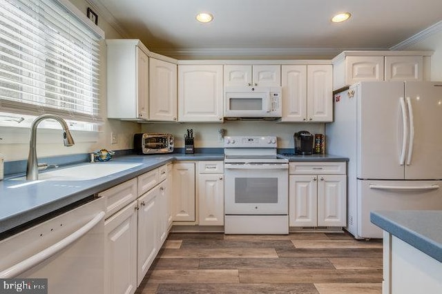 9707 Village Ln Unit 9704-4, Ocean City, MD 21842 - kitchen featuring white appliances, crown molding, white cabinets, recessed lighting, and wood finished floors