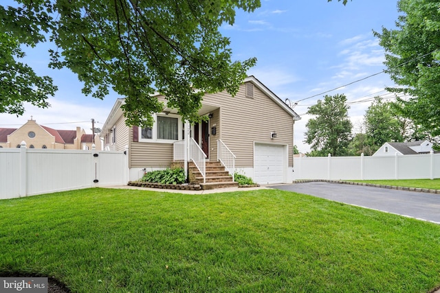 122 Randolph Ave, South Plainfield, NJ 07080 - view of front of house with asphalt driveway, a gate, and a garage