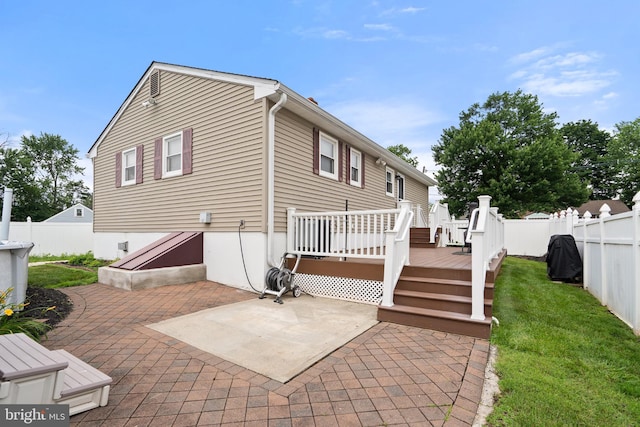 122 Randolph Ave, South Plainfield, NJ 07080 - back of property with a wooden deck, a patio area, and a fenced backyard