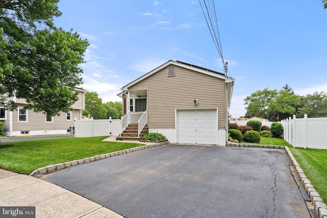 122 Randolph Ave, South Plainfield, NJ 07080 - view of front of property featuring asphalt driveway and a garage