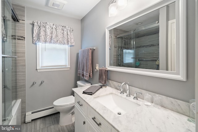 122 Randolph Ave, South Plainfield, NJ 07080 - bathroom with a baseboard heating unit, vanity, and enclosed tub / shower combo