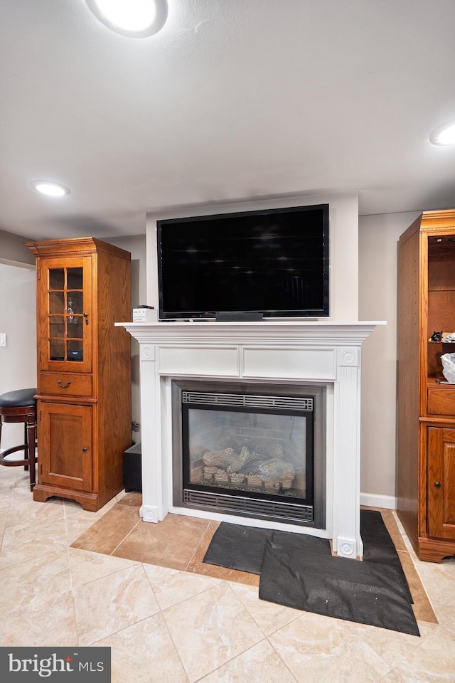 122 Randolph Ave, South Plainfield, NJ 07080 - detailed view of a glass covered fireplace and recessed lighting