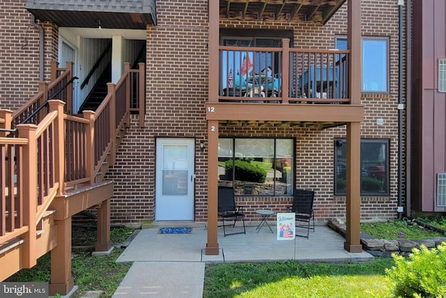 5200 Hilltop Dr Unit A2, Brookhaven, PA 19015 - rear view of property featuring brick siding and a balcony
